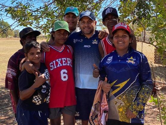 Cowboys legend Matt Bowen with the kids from Doomadgee State School.