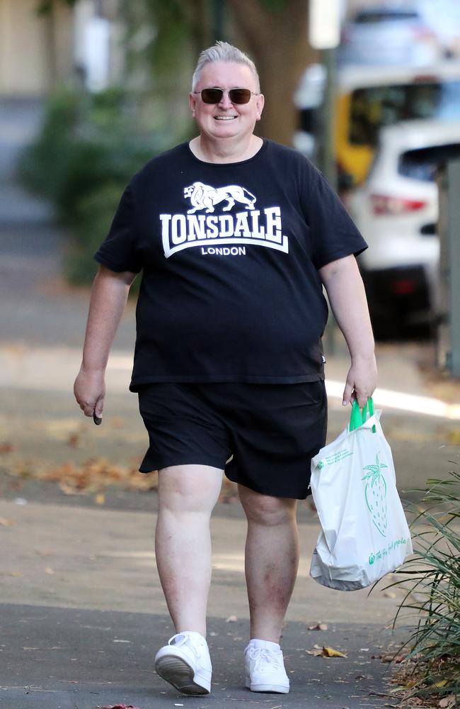 Former NSW minister for the arts Don Harwin was all smiles as he returned home after a lengthy walk the day after resigning. Picture: Tim Hunter