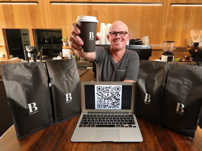 Blackboard Varsity general manager Wayne Keating with a QR Code system to electronically store your details when you wish to dine in for breakfast and coffee. Picture Glenn Hampson