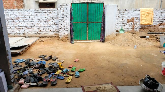 While we were visiting Shrestha, the pile of shoes at the door grew and grew as all the kids in the area came to visit. Photo: Whitney Taylor