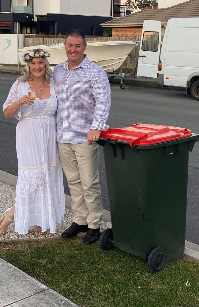 Lee Withers and Chris Boehm on their wedding day. After the ceremony they took their bin out to the footpath to post on the Bin Isolation Outing Facebook page.