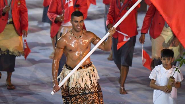 Tonga's flag-bearer Pita Nikolas Taufatofua leads his delegation during the opening ceremony of the Rio 2016 Olympic Games.