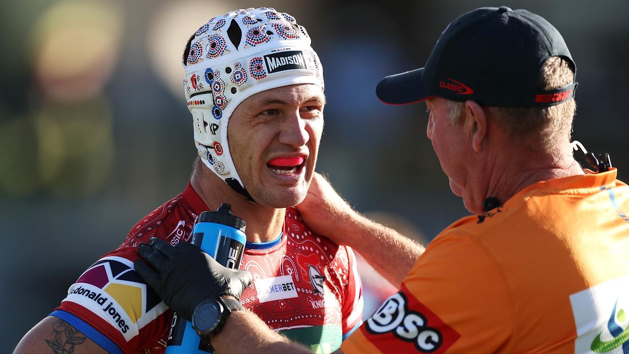 Kalyn Ponga of the Knights receives attention from the trainer during the round 12 NRL match between Cronulla Sharks and Newcastle Knights at Coffs Harbour International Stadium on May 20, 2023 in Coffs Harbour, Australia. (Photo by Mark Kolbe/Getty Images)