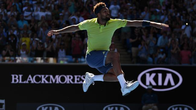 Jo-Wilfried Tsonga leaps high after his five-set win over Denis Shapovalov. Picture: AAP