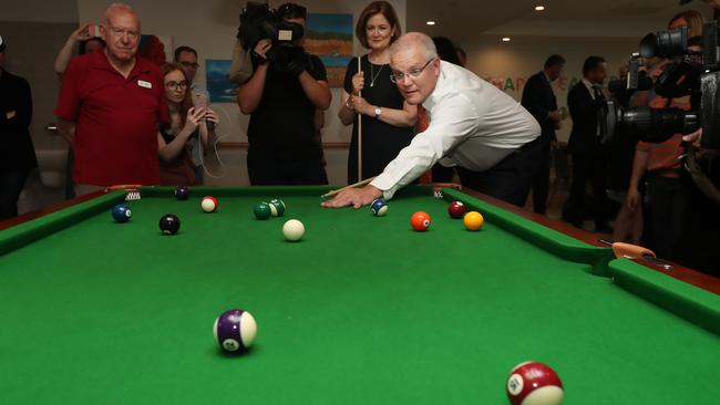 Prime Minister Scott Morrison plays pool with some of the residents during a visit with aged care residents at The Vue at Luson Health, Grovedale. Picture: Gary Ramage