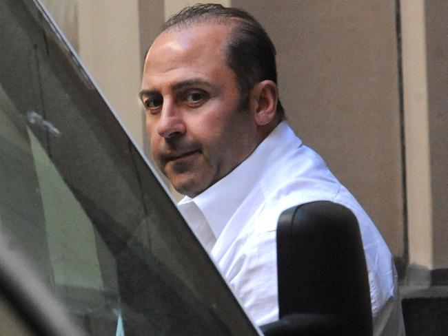 Mokbel is led into a prison van after a Supreme Court hearing in 2011. Picture: AAP Image/Julian Smith