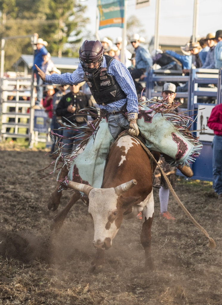 Brendan Kelly kicks up the dust in the Junior Bullride at the Maclean Twilight Rodeo. Picture: Adam Hourigan