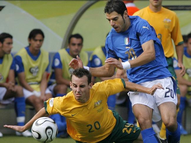 Italy's Simone Perrotta, right, challenges for the ball with Australia's Luke Wilkshire during the Australia vs Italy Round of 16 World Cup soccer match at Fritz Walter Stadium in Kaiserslautern.