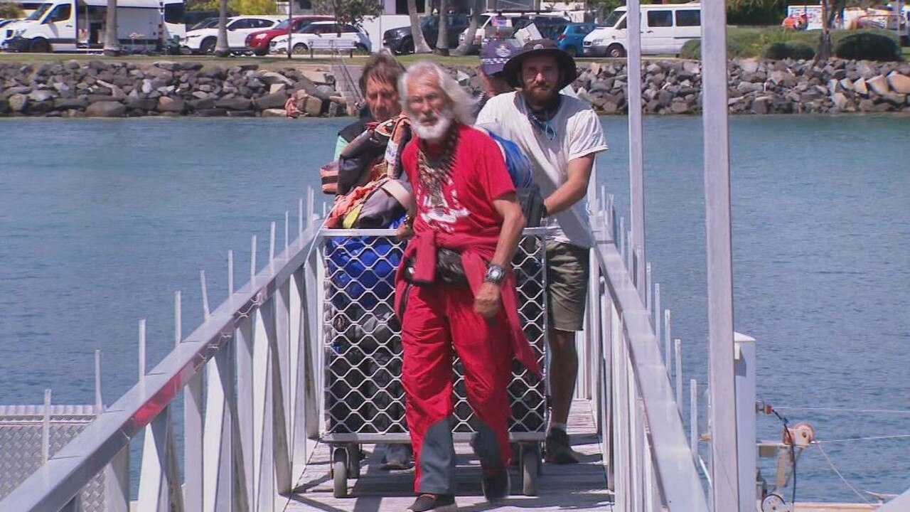 Evgeny Kovalevsky, dressed in red, and his crew. Picture: 9 News