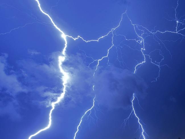 TOPSHOT - Lightning strikes during a thunderstorm in Montevideo on February 20, 2022. (Photo by Mariana SUAREZ / AFP)