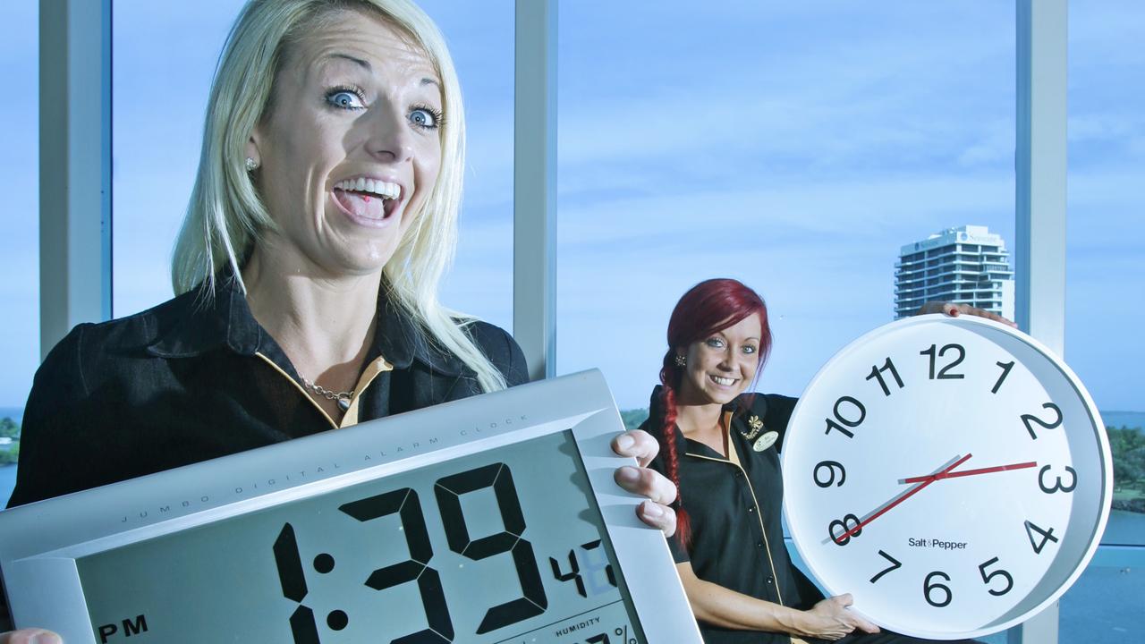 Twin Towns staff members Kelly Sills, 25, from Banora Point, (blonde) and Bec Ford, 27, from Coolangatta attempt to make sense of the upcoming daylight saving time which takes effect in NSW this weekend. Pic Tim Marsden