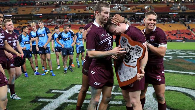 Sam Walker and Reece Walsh embrace Joshua James after Queensland U18s’ 34-12 win over NSW at Suncorp Stadium last week. Picture: Adam Head