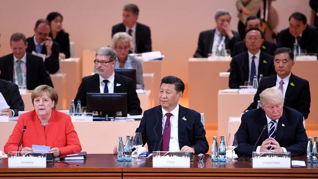 German Chancellor Angela Merkel, Chinese President Xi Jinping and US President Donald Trump attend the first plenary session during the G20 summit in Hamburg in 2017.