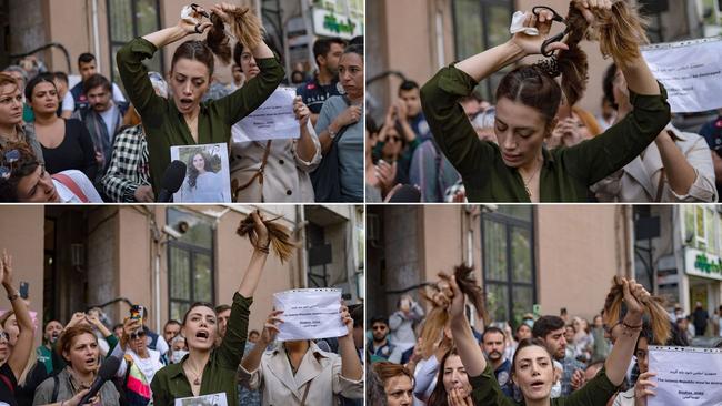 Nasibe Samsaei, an Iranian woman living in Turkey, cutting off her ponytail during a protest outside the Iranian consulate in Istanbul. Picture: Yasin Akgul/AFP