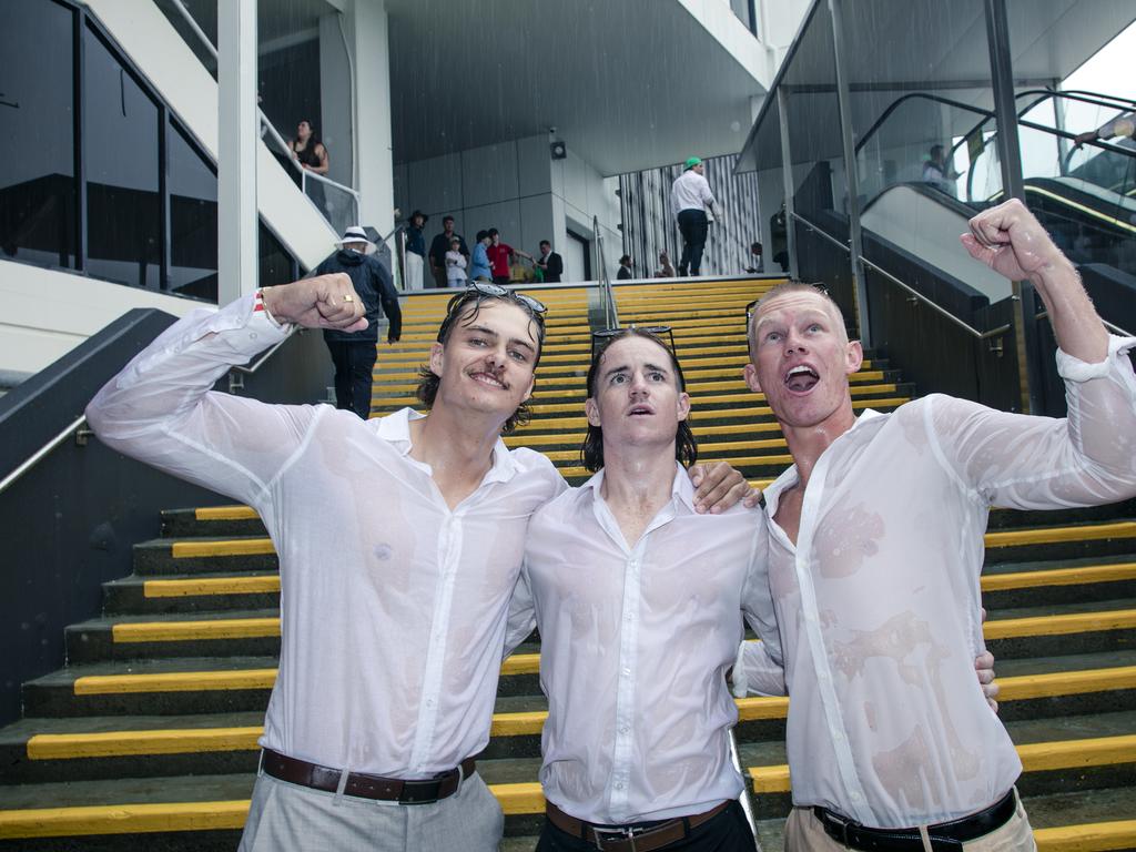 Joshua Young, Cade Gregory and Luke Coombes didn’t let the weather dampen their spirits. Picture: Glenn Campbell