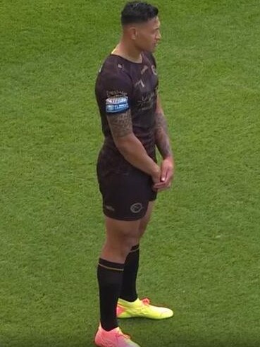 Israel Folau stands up during the moment of reflection