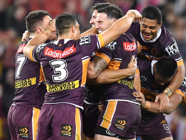 Broncos players celebrate winning after Jamayne Isaako kicked the winning field goal during the Round 24 NRL match between the Brisbane Broncos and the Parramatta Eels at Suncorp Stadium in Brisbane, Friday, August 30, 2019.  (AAP Image/Darren England) NO ARCHIVING, EDITORIAL USE ONLY