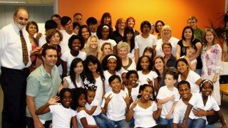 Diane Harapin pictured with families involved in adoption who performed with singer Seal, who was adopted, in 2011. Picture: supplied.