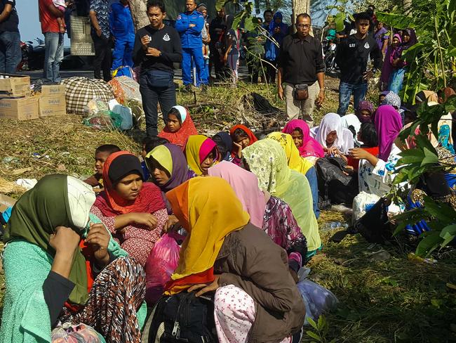 A group of 34 women and children dumped on mudflats in northern Malaysia by their smugglers. Picture: AFP