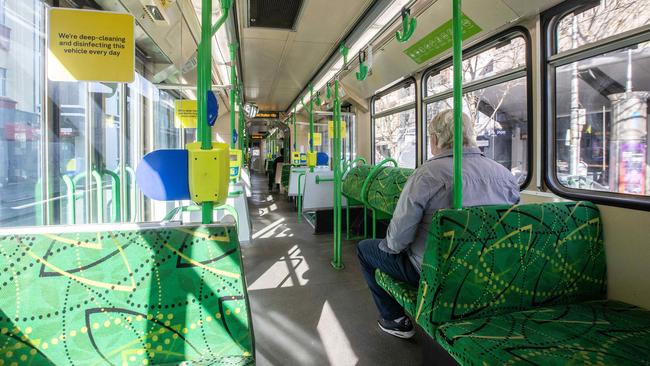 A lone tram passenger in Melbourne on Monday. Picture: Sarah Matray