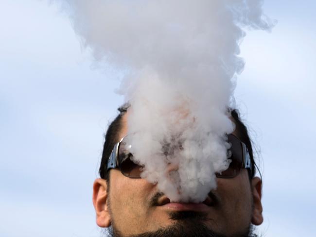 Demonstrator vapes during a rally outside of the White House to protest the proposed vaping flavor ban in Washington DC on November 9, 2019. (Photo by Jose Luis Magana / AFP)