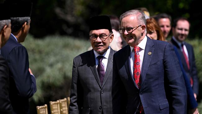 Malaysia's Prime Minister Anwar Ibrahim introduces Australia's Prime Minister Anthony Albanese to the Malaysian delegation during the Australia-ASEAN summit in Melbourne. Picture: William West/ AFP