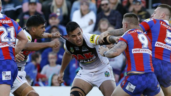 Viliame Kikau of the Panthers tussles with Daniel Levi and Shaun Kenny-Dowall of the Knights during the Round 23 NRL match between the Penrith Panthers and the Newcastle Knights at Panthers Stadium. Picture: AAP Image