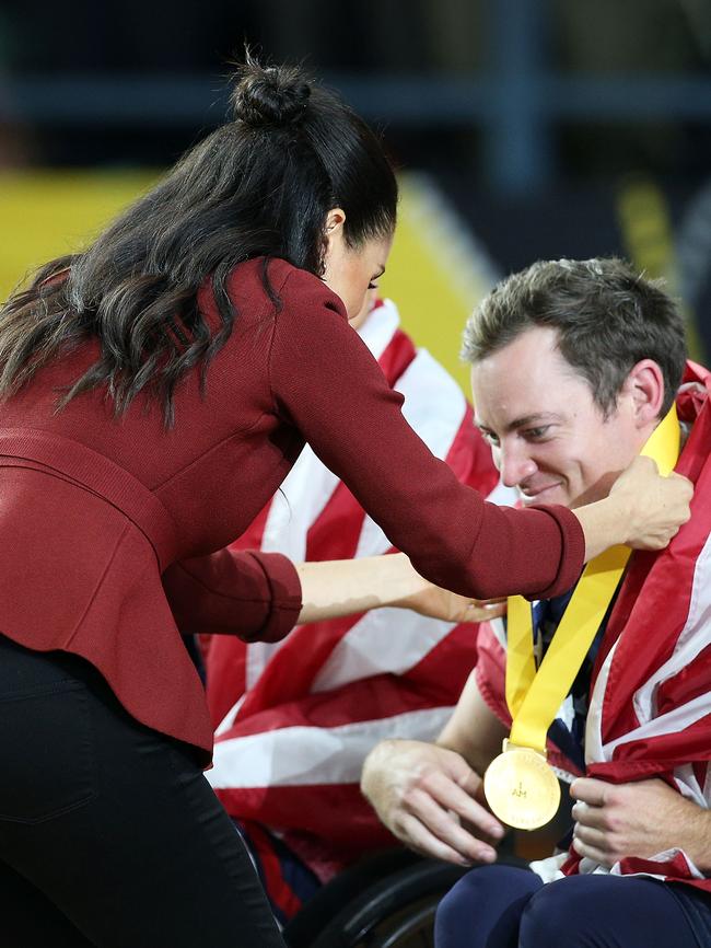 Meghan, Duchess of Sussex presents medals to team USA during the Wheelchair Basketball finals. Picture: Lisa Maree Williams/Getty Images