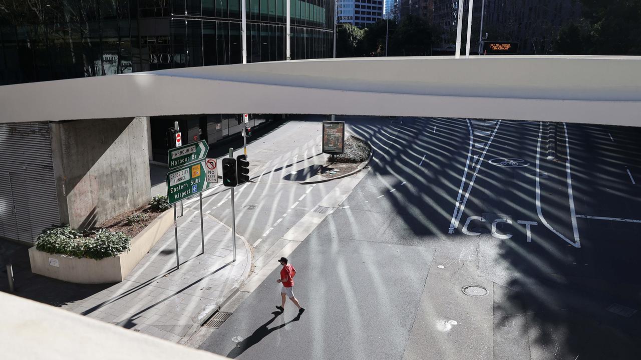 A man walks through a deserted Sydney CBD. Picture: NCA NewsWire / Dylan Coker