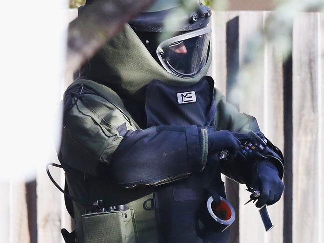 MELBOURNE, AUSTRALIA - JUNE 06:  An explosives device detector is sent down the driveway with keys outside service apartments on June 6, 2017 in Melbourne, Australia. Police are treating an incident where an armed man shot and killed a man and held a woran hostage as an act of terror. The alleged offender Yacqub Khayre was shot and killed following a lengthy stand off with police on Monday in the southern Melbourne suburb of Brighton. Khayre was known by counter-terrorism police and had been on parole. Terror group Islamic State has claimed responsibility for the siege.  (Photo by Michael Dodge/Getty Images)