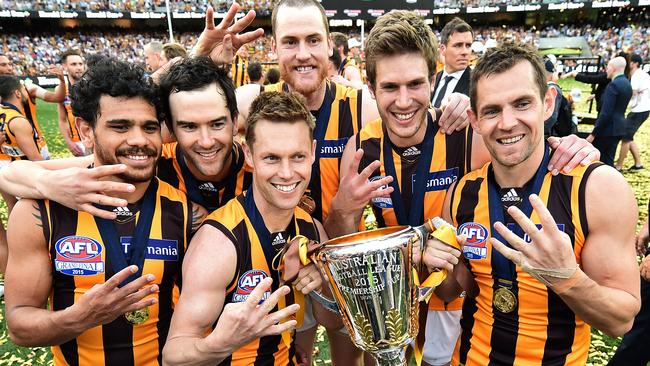 Grant Birchall with Hawthorn teammates after their fourth premiership win. Picture: AAP Image/Julian Smith