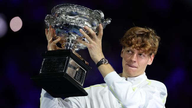 MELBOURNE, AUSTRALIA - JANUARY 26: Jannik Sinner of Italy  poses with the Norman Brookes Challenge Cup at the Men's Singles trophy presentation following the Men's Singles final against Alexander Zverev of Germany during day 15 of the 2025 Australian Open at Melbourne Park on January 26, 2025 in Melbourne, Australia. (Photo by Clive Brunskill/Getty Images)