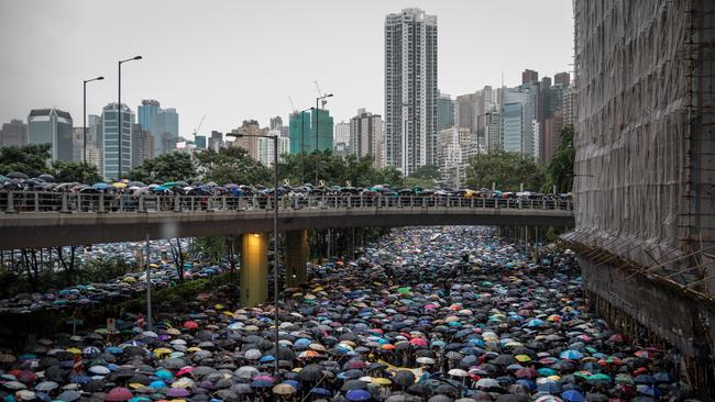 Thousands of anti-government protesters march on the streets after leaving a rally in Victoria Park in Hong Kong, China on the weekend. Picture: Getty Images