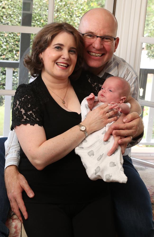 Lucinda and Damon Simpson at home with their baby boy Angus. Photographer: Liam Kidston.