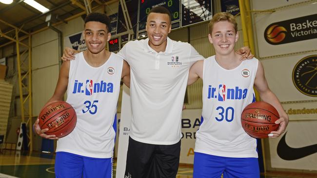 Geelong junior basketball players Tyerell Luscombe-Shockley and Matthew Teale with Aussie NBA star at June’s Basketball Without Borders camp.