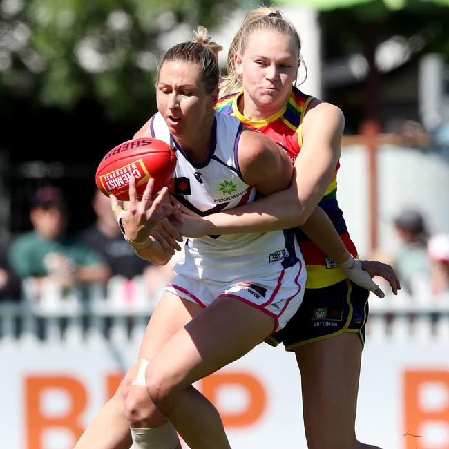 Janelle Cuthbertson of the Dockers is tackled by Montana McKinnon.