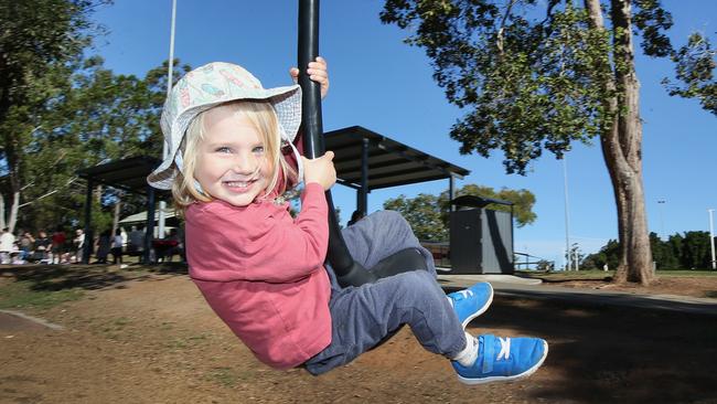 Sam Perry (3) has fun in Underwood Park. Qld is enjoying a fine and sunny weekend after a day of rain and fog. (AAP Image/Jono Searle)