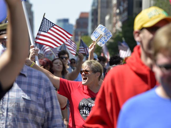 Marchers take part in the "Straight Pride" parade in Boston, on August 31, 2019. - "Straight Pride" advocates who support President Donald Trump and counter-demonstrators who consider them homophobic extremists staged dueling rallies in Boston on Saturday. (Photo by Joseph PREZIOSO / AFP)