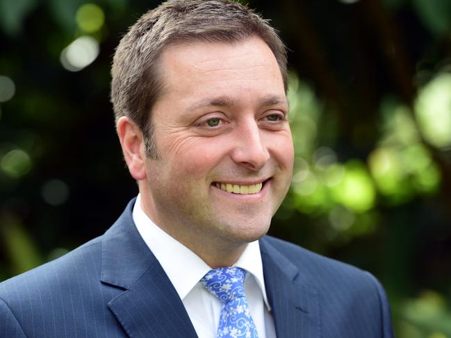 Victorian Opposition Leader Matthew Guy smiles at a media conference at State Parliament in Melbourne, Tuesday, April 28, 2015. Mr Guy was commenting on the Andrews' government announcement of a $1.5 billion funding package for preliminary works for the metro underground rail project. (AAP Image/Julian Smith) NO ARCHIVING