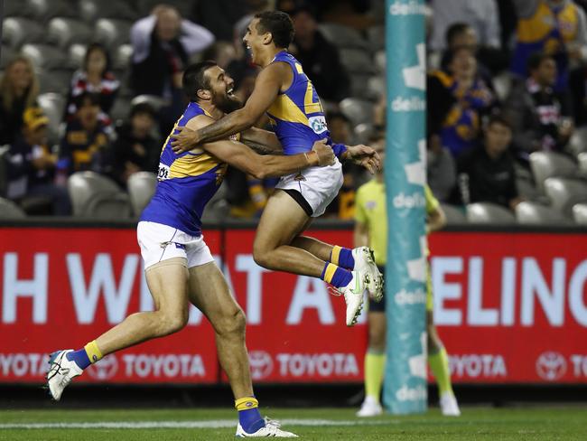 Isiah Winder celebrates with Josh Kennedy after joining the first kick, first goal club. Picture: AFL Photos/Getty Images