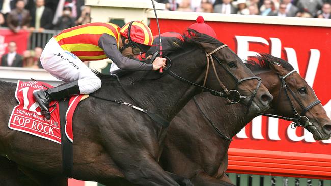 Damien Oliver gives chase on Pop Rock but can’t built Japanese stablemate Delta Blues. Picture: Wayne Ludbey