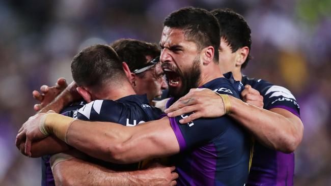 SYDNEY, AUSTRALIA — OCTOBER 01: Jesse Bromwich of the Storm celebrates the try to Dale Finucane with team mates during the 2017 NRL Grand Final match between the Melbourne Storm and the North Queensland Cowboys at ANZ Stadium on October 1, 2017 in Sydney, Australia. (Photo by Matt King/Getty Images)