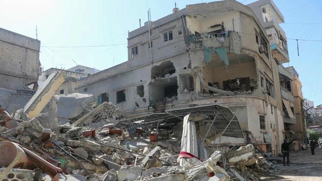 Emergency services clear the rubble from the site of an Israeli strike that targeted the southern Lebanese city of Tyre on Wednesday. Picture: Kawnat Haju/AFP