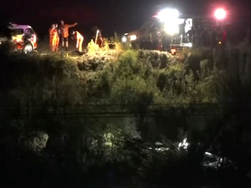 Paramedics and police at the scene in Wilberforce battled with difficult terrain and low light to reach the boat wreckage.