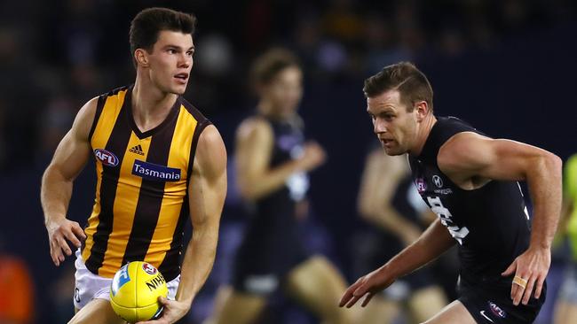 Hawk Jaeger O'Meara gives Carlton's Sam Docherty the slip. Pic: Michael Klein