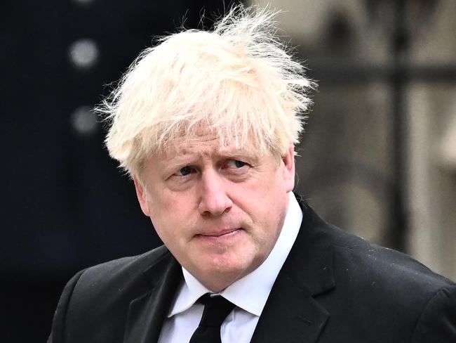 (FILES) In this file photo taken on September 19, 2022 Former British Prime Minister Boris Johnson and his wife Carrie Johnson arrive at Westminster Abbey in London for the State Funeral Service for Britain's Queen Elizabeth II. - British Conservative Rishi Sunak was on October 24, 2022 poised to become prime minister and the country's first leader of colour, after the dramatic decision by Boris Johnson to abandon an audacious political comeback. (Photo by Marco BERTORELLO / AFP)