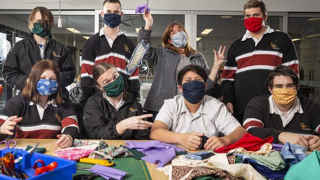 Textiles teacher Dee Arambasic teaches students to make masks, at Melba College in Croydon, Melbourne. Picture: Daniel Pockett