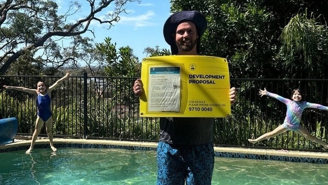 Andrew Duncan celebrates the approval for his development application with his children.