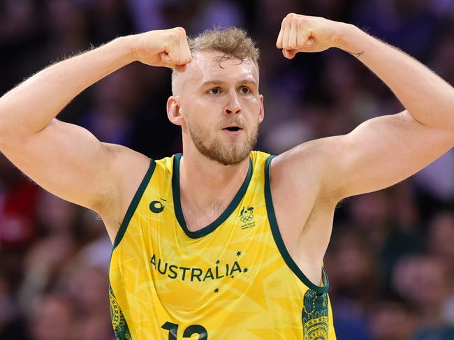 LILLE, FRANCE - JULY 27: Jock Landale of Australia celebrates during the Men's Group Phase - Group A match between Australia and Spain on day one of the Olympic Games Paris 2024 at Stade Pierre Mauroy on July 27, 2024 in Lille, France. (Photo by Christina Pahnke - sampics/Getty Images)