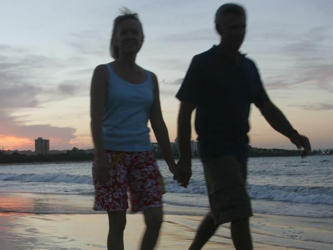 A couple walk hand in hand it Mooloolaba Beach as the sun sets.Photo Brett Wortman / Sunshine Coast Daily***PEOPLE MUST NOT BE IDENTIFIABLE***